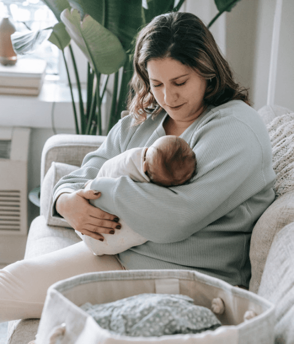 A mom sitting calmly at home, holding a clear sense of her own space